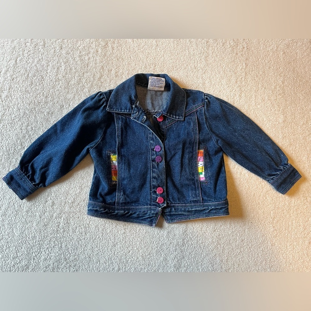 Vintage jean jacket, 24 mos. Colorful buttons and pocket lining, shoulder puffs.